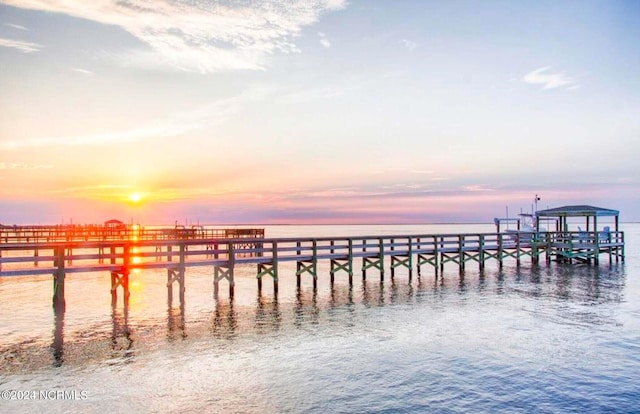 dock area with a pier and a water view