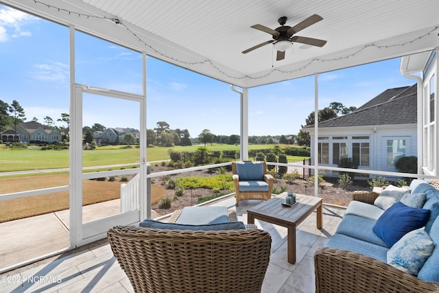 sunroom / solarium with ceiling fan