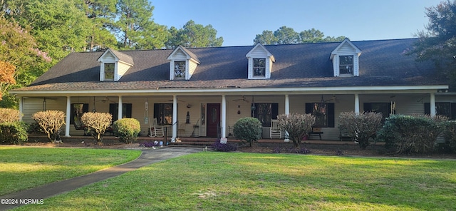 view of front facade with a porch and a front lawn