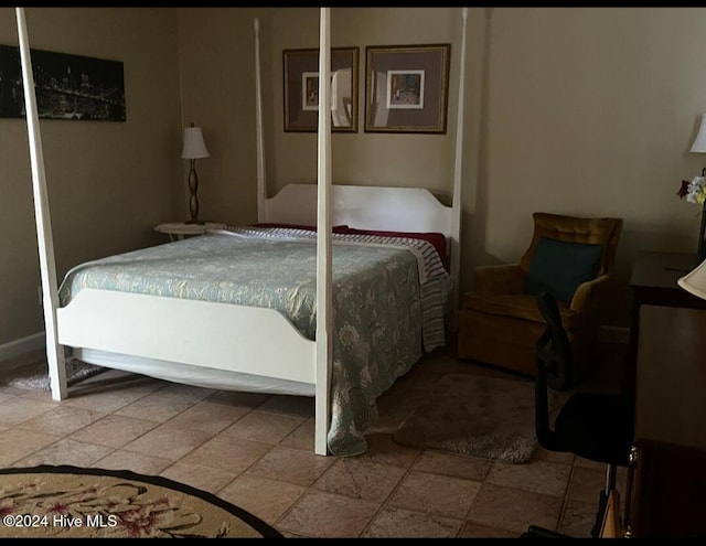 bedroom with stone finish flooring