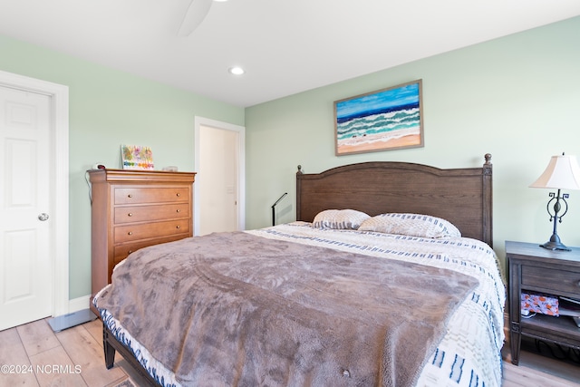 bedroom featuring baseboards, a ceiling fan, light wood-style flooring, and recessed lighting