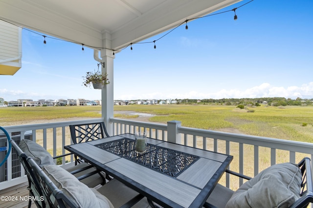 wooden terrace featuring outdoor dining space