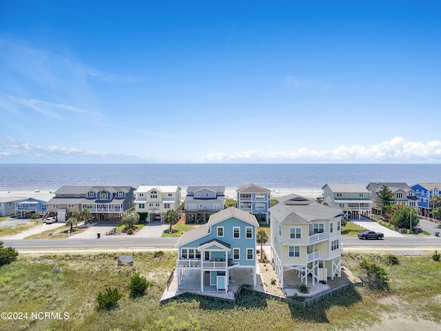 bird's eye view featuring a water view and a residential view