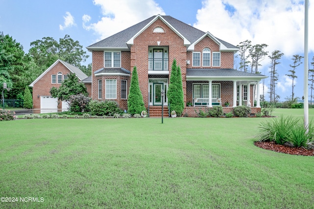 view of front of property with a front yard and covered porch