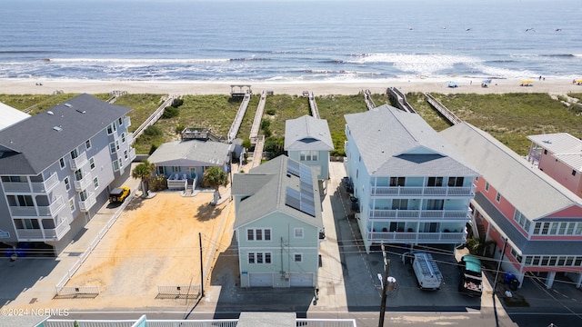 aerial view featuring a view of the beach and a water view