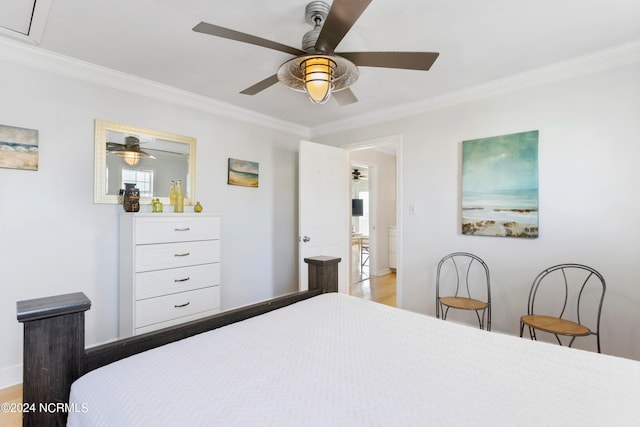 bedroom featuring ornamental molding, hardwood / wood-style flooring, and ceiling fan