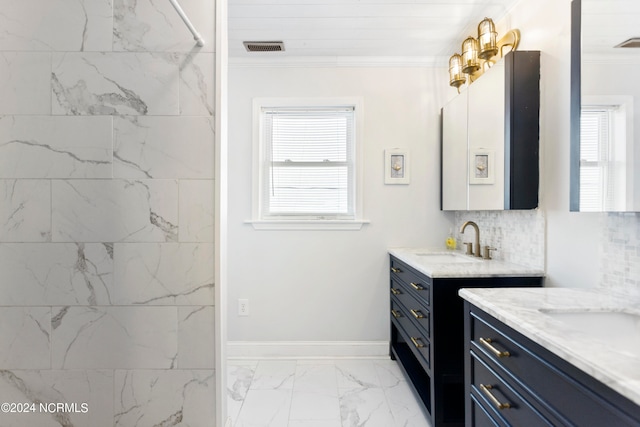 bathroom with tile patterned floors, vanity, tiled shower, decorative backsplash, and ornamental molding