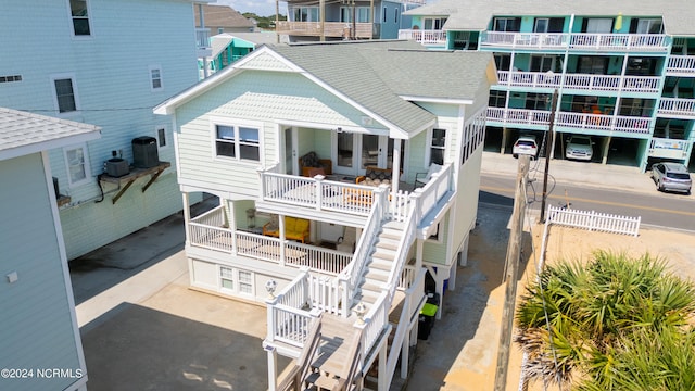 back of house with a balcony and central AC