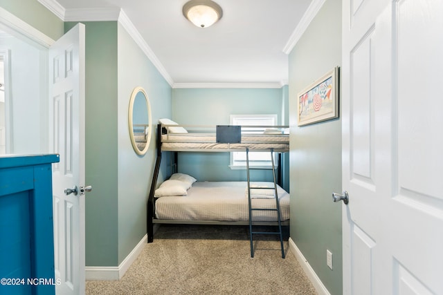 carpeted bedroom with ornamental molding