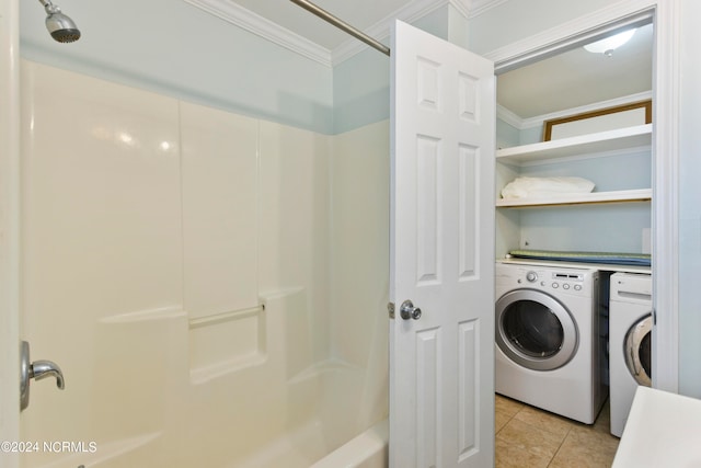 washroom featuring ornamental molding, independent washer and dryer, and light tile patterned floors