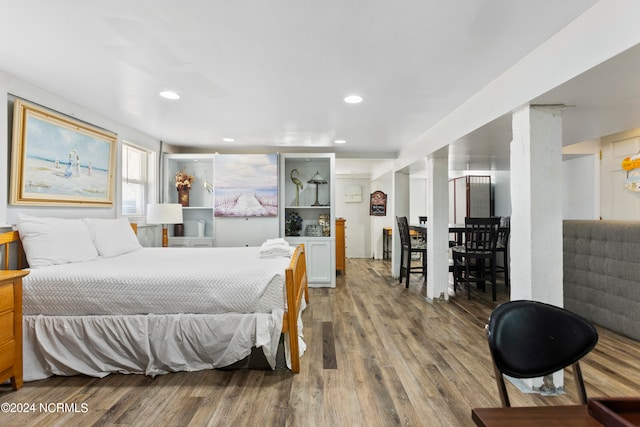 bedroom with hardwood / wood-style flooring