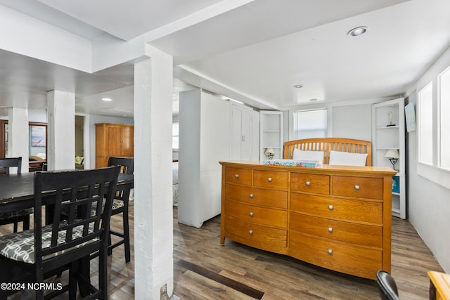 interior space with dark hardwood / wood-style floors and a healthy amount of sunlight