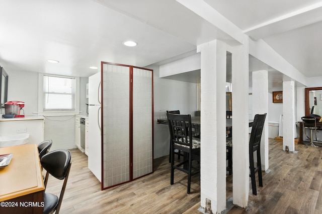 kitchen featuring white cabinets and light hardwood / wood-style floors