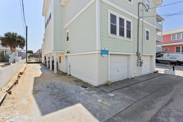 view of property exterior with a garage