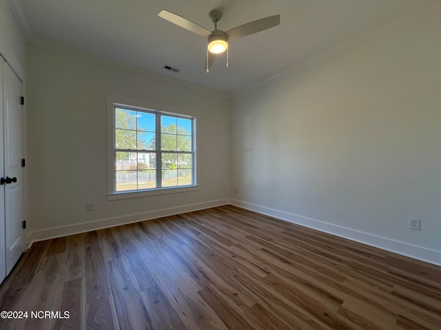 unfurnished room with ornamental molding, hardwood / wood-style flooring, and ceiling fan