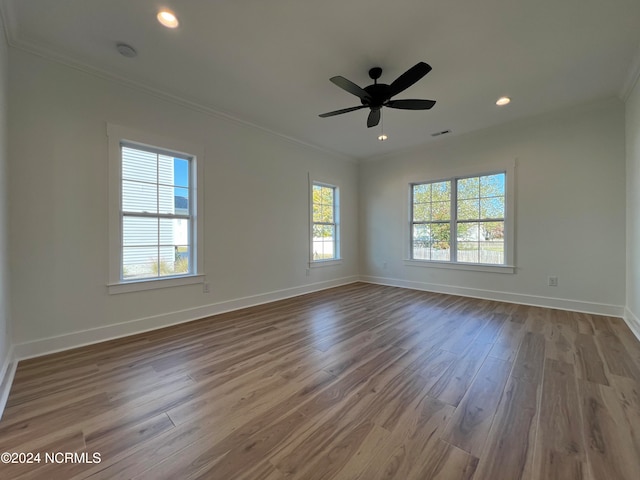 spare room featuring ornamental molding, wood-type flooring, and ceiling fan