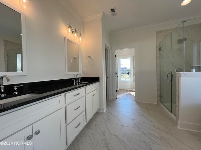 bathroom with a shower with door, vanity, and ornamental molding