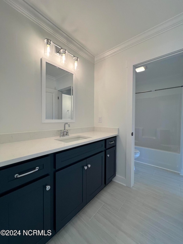 full bathroom with vanity, toilet, ornamental molding, and separate shower and tub