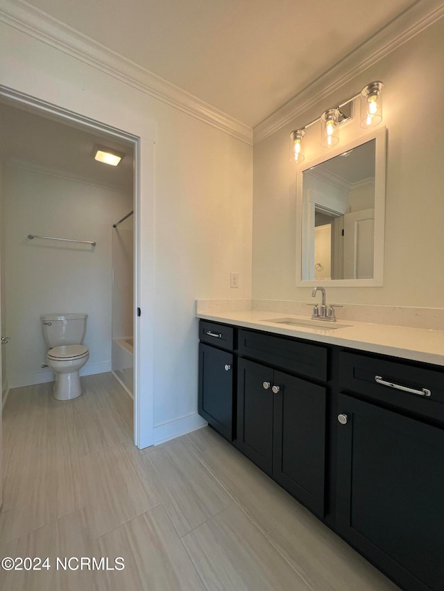 full bathroom featuring vanity, toilet, ornamental molding, and bathing tub / shower combination