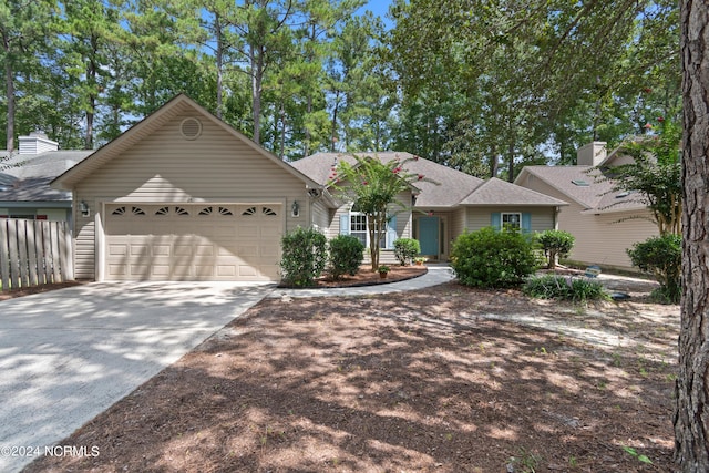 single story home with an attached garage and driveway