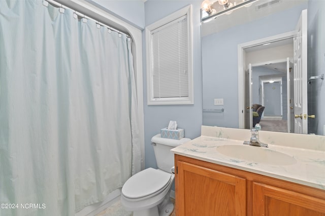 full bathroom featuring toilet, curtained shower, visible vents, and vanity