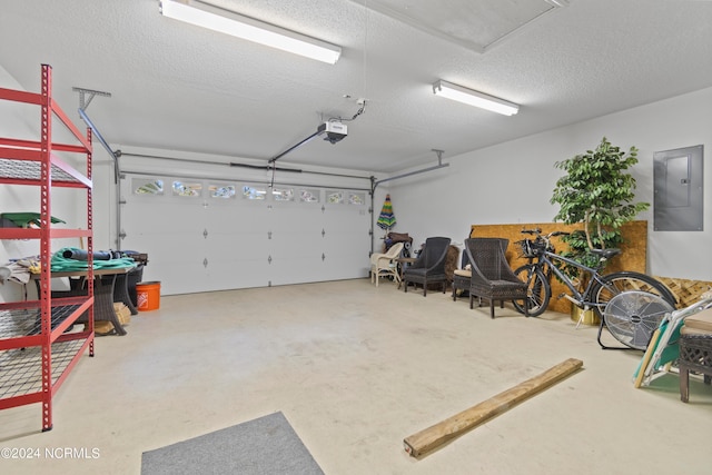 garage featuring electric panel and a garage door opener