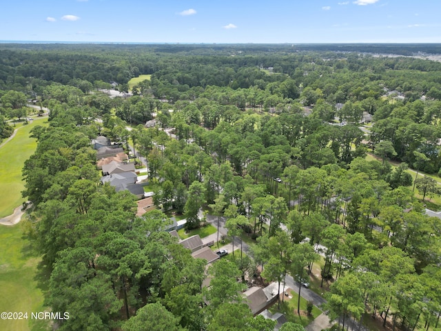 drone / aerial view featuring a forest view