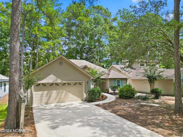 view of front of house featuring an attached garage and driveway