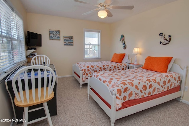 bedroom with ceiling fan and carpet flooring