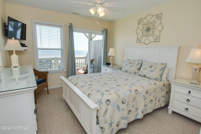 bedroom featuring light carpet, access to outside, and ceiling fan