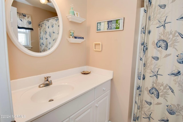 bathroom with vanity and walk in shower