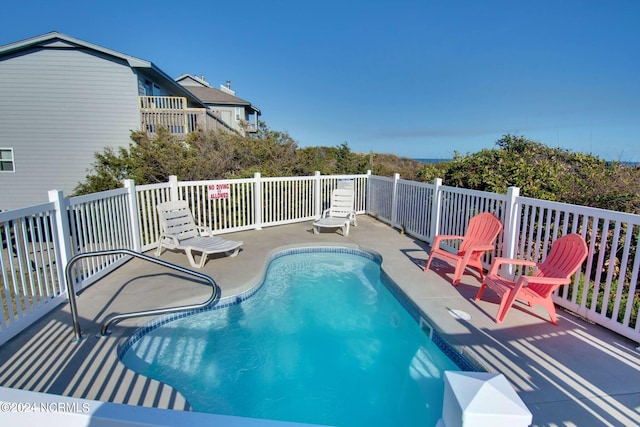 view of pool featuring a patio area