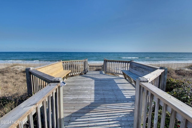 view of property's community with a view of the beach and a water view