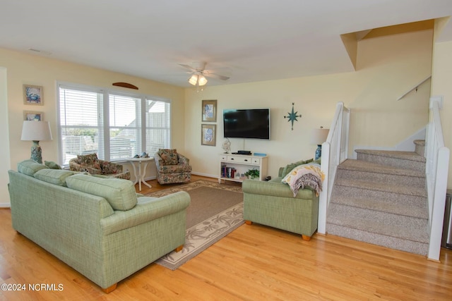 living room with ceiling fan and hardwood / wood-style floors