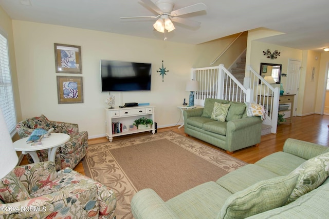 living room featuring hardwood / wood-style flooring and ceiling fan