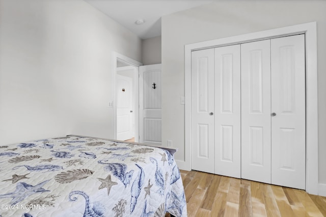 bedroom featuring a closet and hardwood / wood-style floors