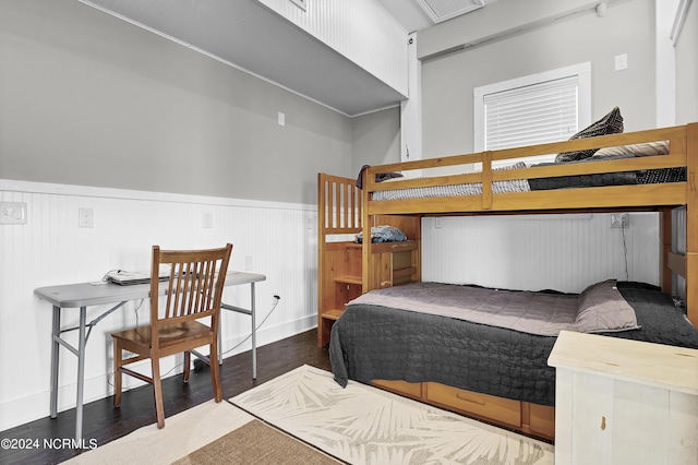 bedroom featuring dark hardwood / wood-style flooring