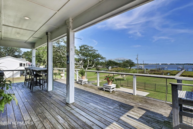 wooden terrace with a yard