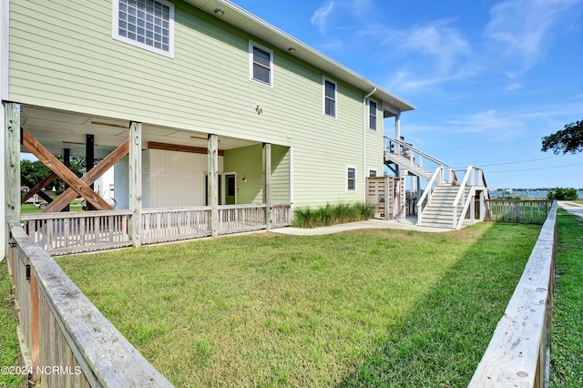 back of house featuring a yard