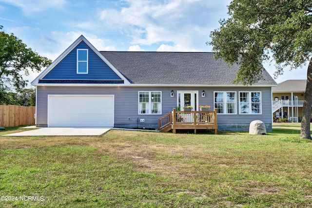 view of front of house with a front lawn, a garage, and a wooden deck