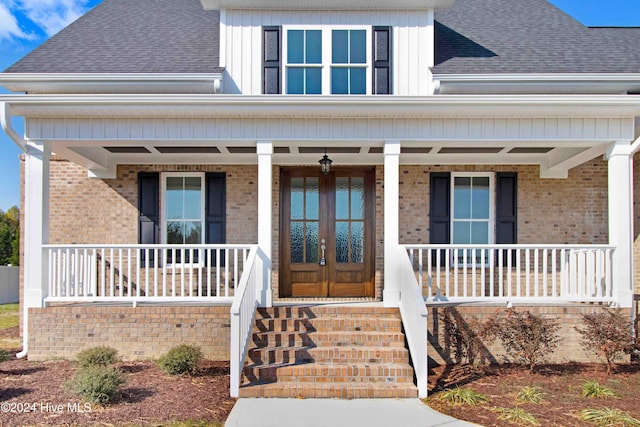 view of front of property with a porch and french doors