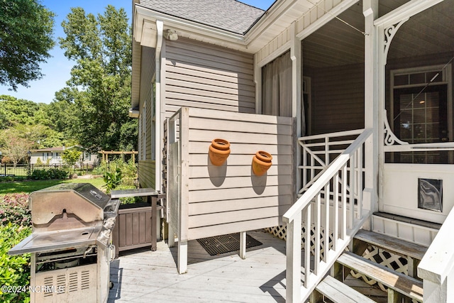 wooden deck featuring area for grilling