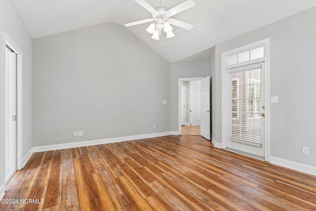 unfurnished bedroom featuring lofted ceiling, ceiling fan, hardwood / wood-style floors, and access to outside