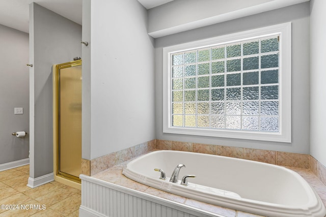 bathroom featuring shower with separate bathtub and tile patterned floors