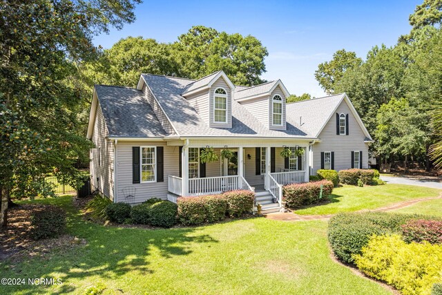 cape cod-style house with a porch and a front lawn