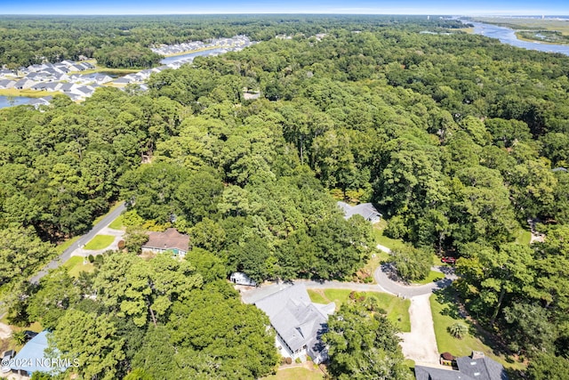 bird's eye view with a residential view, a water view, and a wooded view