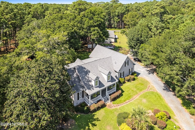 aerial view featuring a view of trees