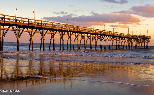 view of dock featuring a pier and a water view