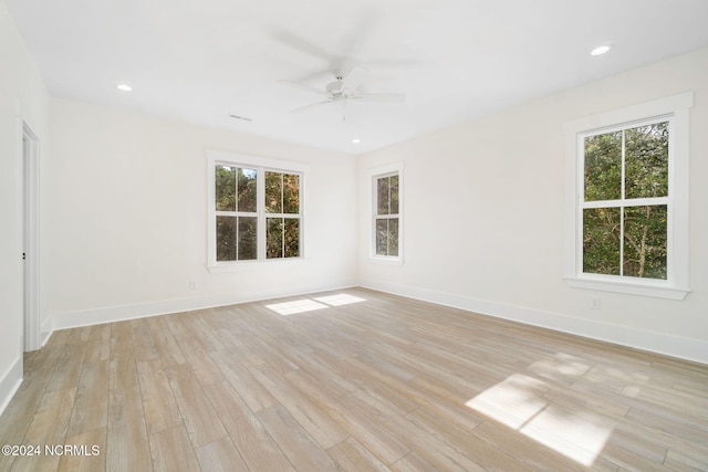 spare room with ceiling fan and light hardwood / wood-style floors