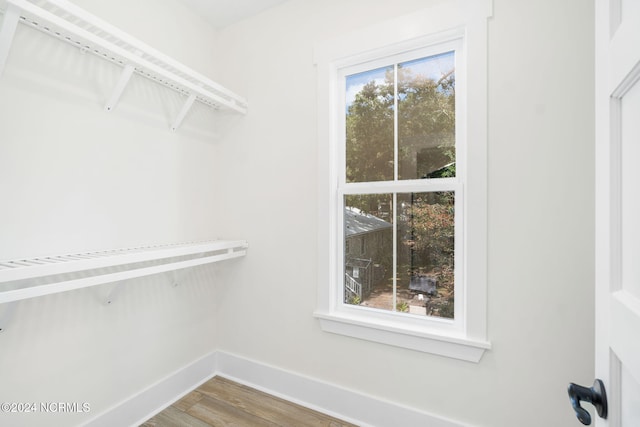 walk in closet featuring hardwood / wood-style floors